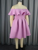 a mannequin wearing a purple dress and black shoes