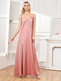 Elegant pink spaghetti strap evening gown with side slits, size M.