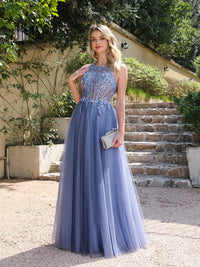 a woman in a blue dress standing in front of some steps