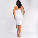 a woman in a white dress is standing back to back