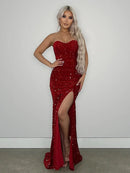 Red strapless sequin prom dress with side slit.