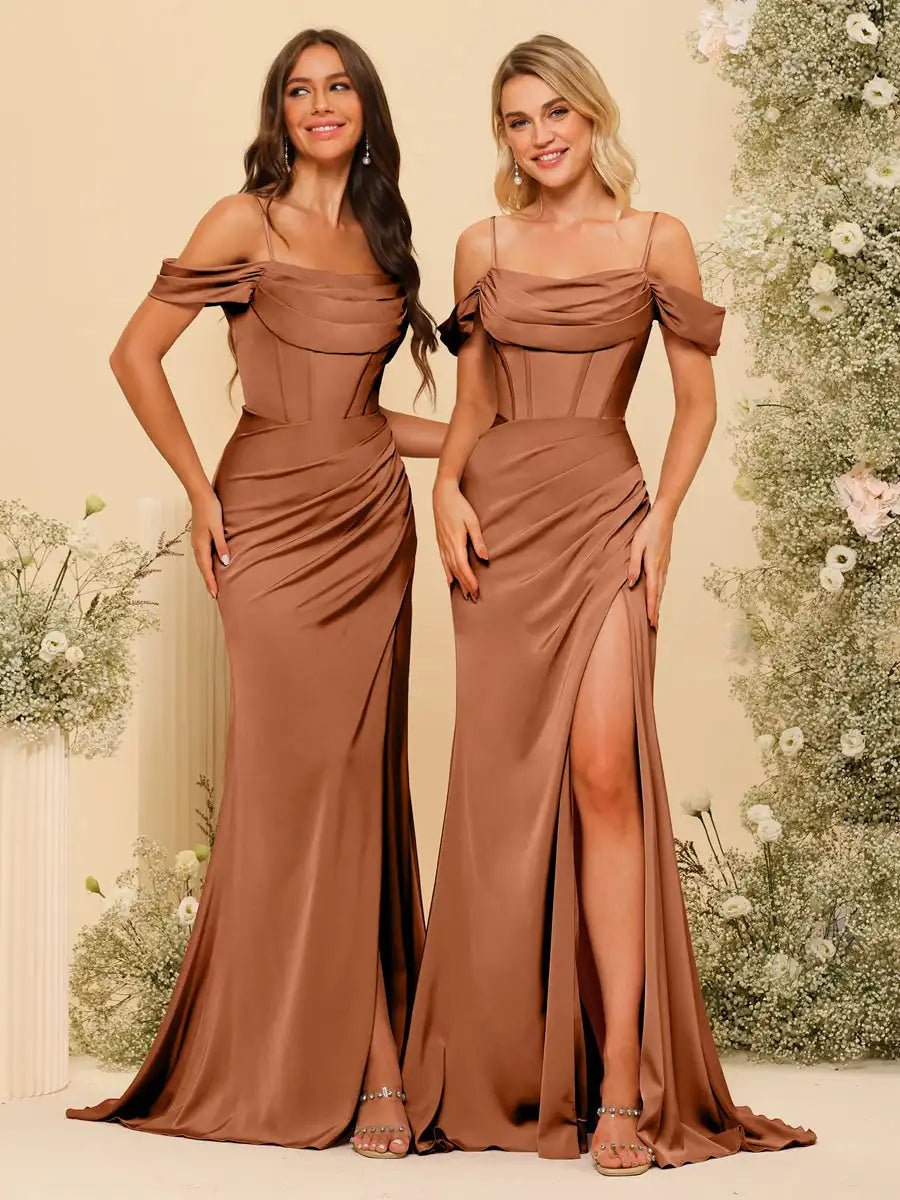 two women standing next to each other in brown dresses