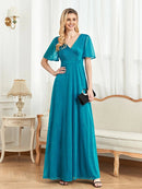 Turquoise short-sleeve elegant evening gown with intricate detailing.