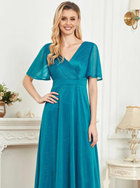 Elegant turquoise short sleeve evening gown, size M, with a flowing design.