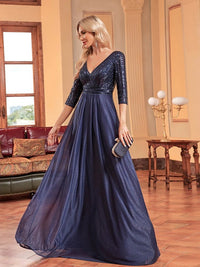 Elegant navy V-neck sequin bodice formal dress with 3/4 sleeves.