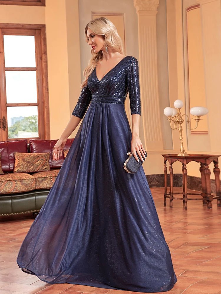 Elegant navy V-neck sequin bodice formal dress with 3/4 sleeves.