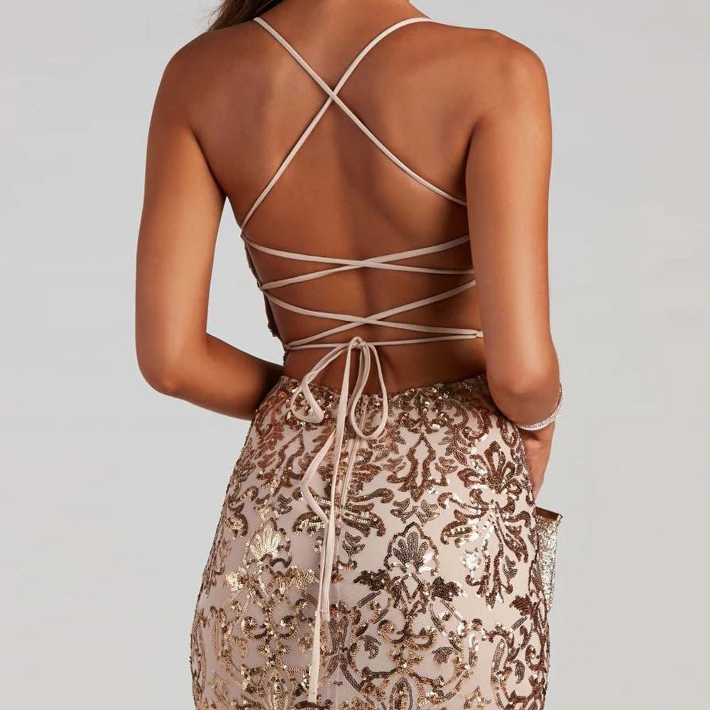 the back of a woman wearing a gold sequin skirt